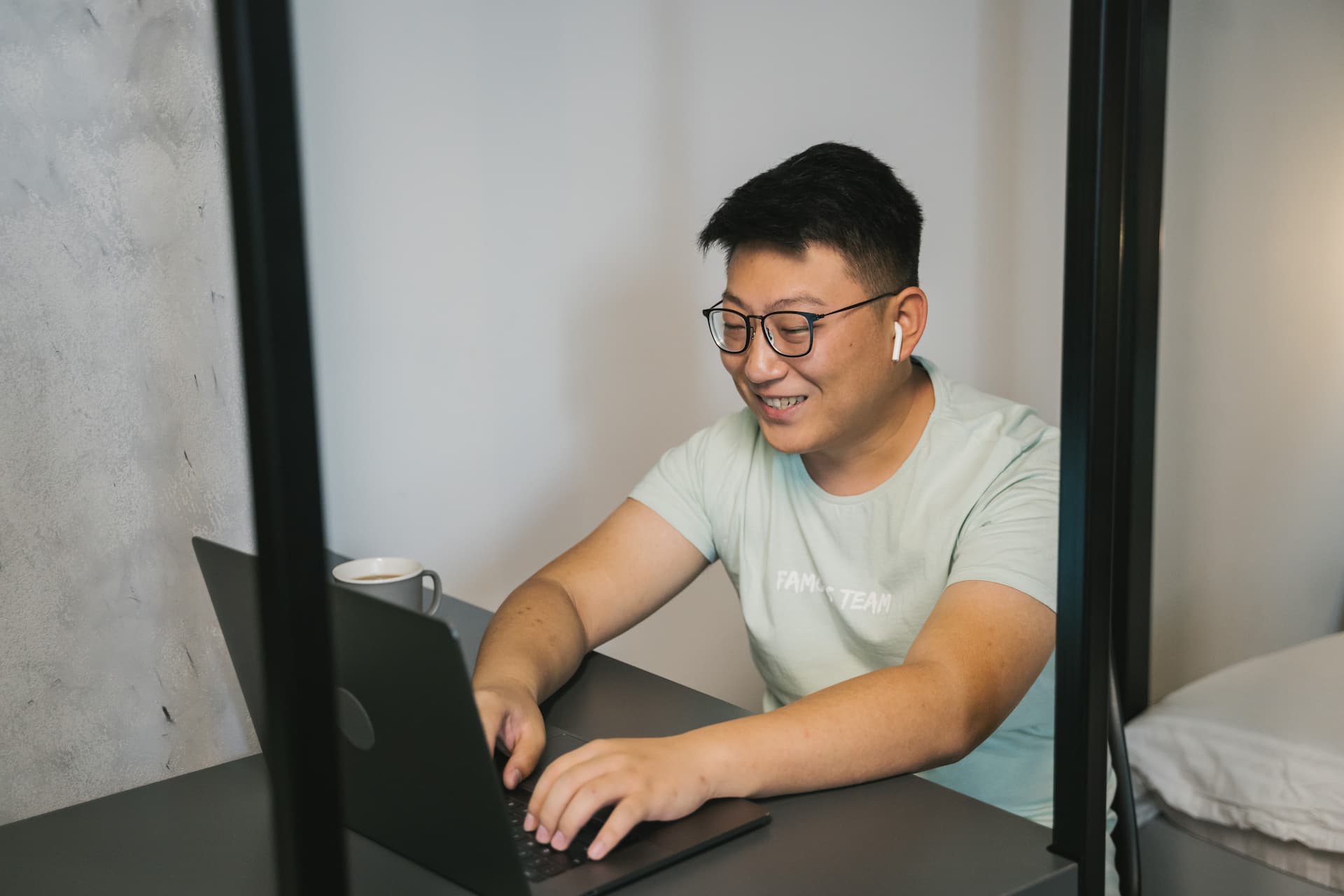 Guy smiling at laptop